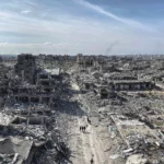 displaced-palestinians-start-to-return-their-houses-past-damaged-houses-in-jabalia-and-beit-lahia-regions-passing-through-al-saftawi-street-in-the-north-of-gaza