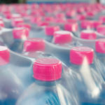 bottled water bottles in plastic wrap