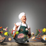 Chef juggling with vegetables and other food in the kitchen