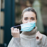 Portrait of a beautiful Caucasian woman wearing a protective face mask